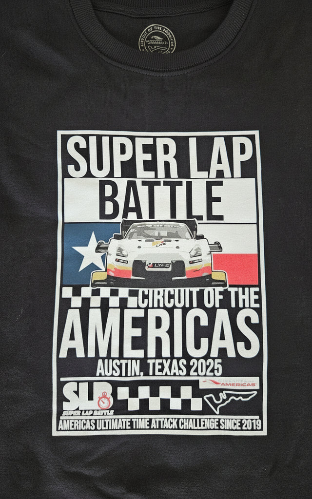 Black sweater top with a graphic design featuring text and a race car.