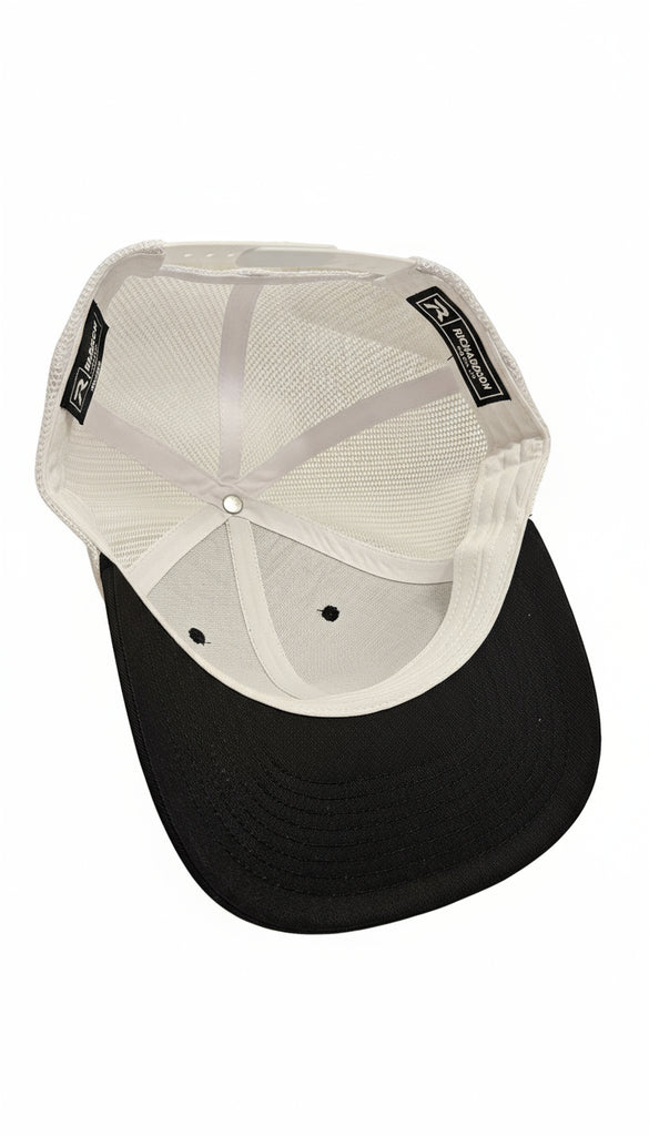 Black and white cap on a textured surface