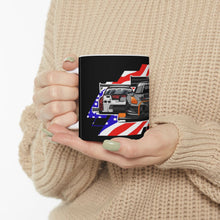 Load image into Gallery viewer, Person holding a mug with a car design featuring American flag colors.